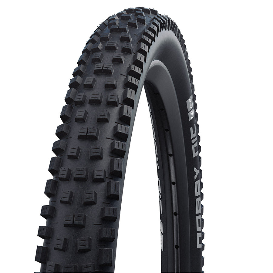 Schwalbe Nobby Nic mountain bike tire with knobby tread for rugged off-road cycling, shown in close-up view.