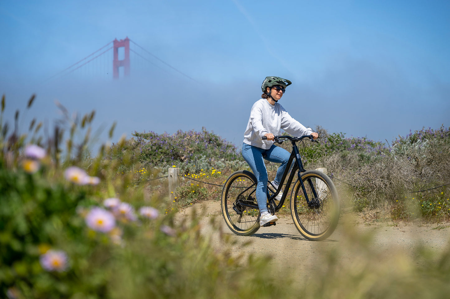 Marin Stinson 1 ST urban city bicycle with sleek frame and modern design, shown in a dynamic riding position.
