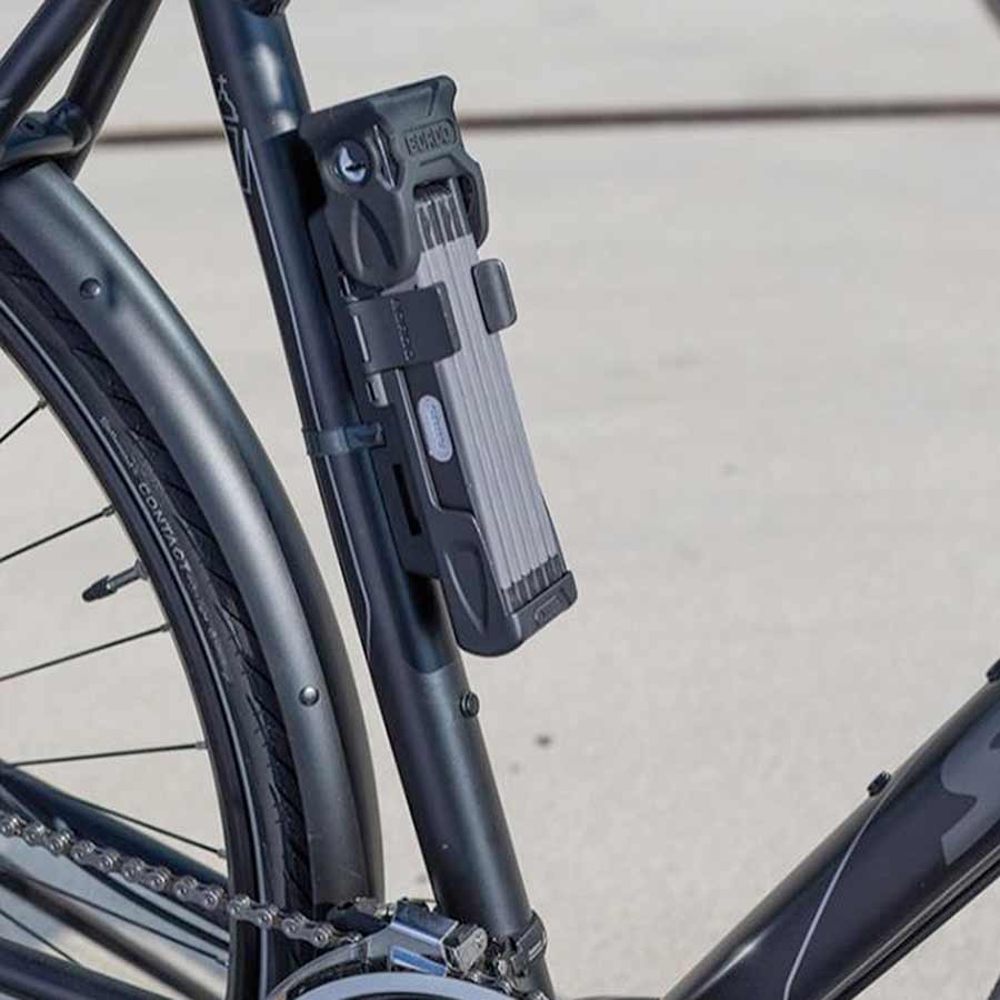 Abus Bordo Combo 6100 folding lock with multiple steel links and combination keypad for secure bike protection.