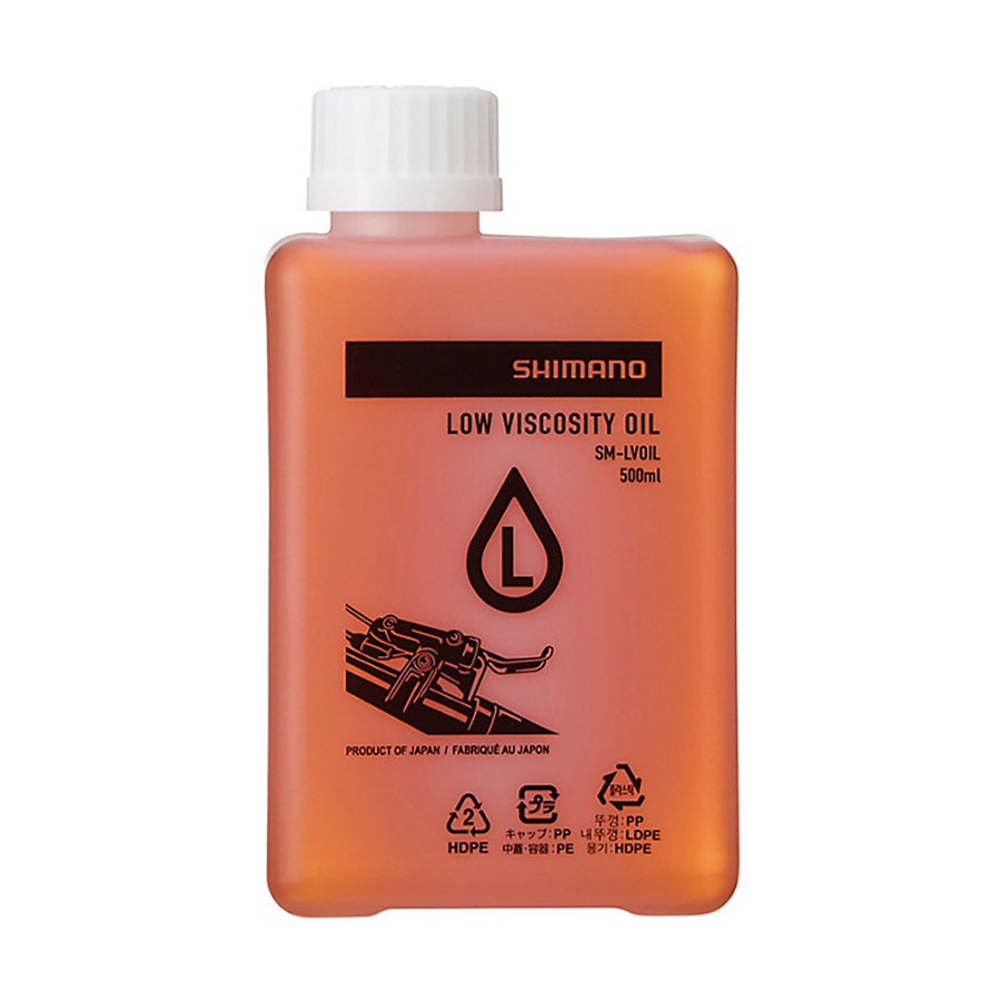 Shimano SM-LVOIL disc brake bleed kit and fluid set with tools for bicycle brake maintenance, shown in the image.