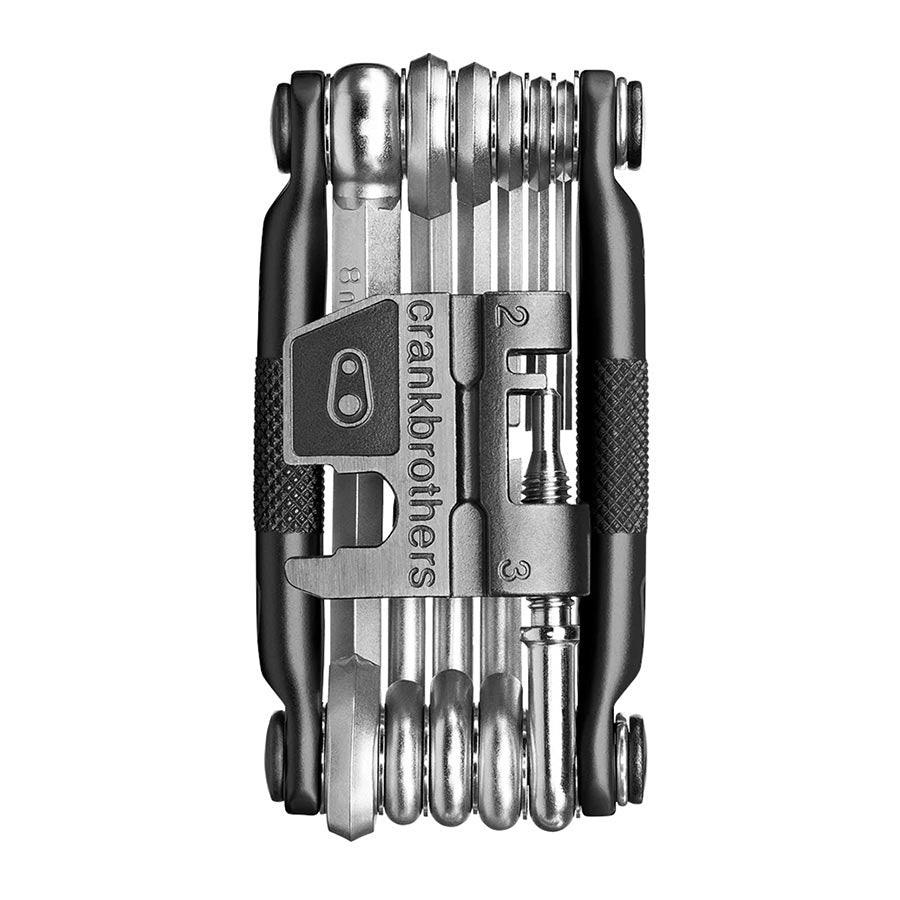 Crankbrothers Multi 17 multi-tool in black and red with various hex and screwdrivers, compact for bike repairs.