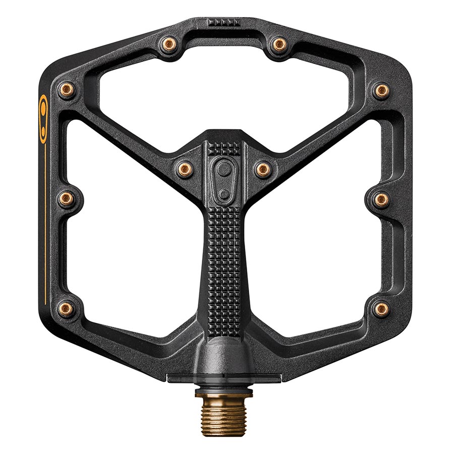 Crankbrothers Stamp 11 platform pedals with large aluminum body and titanium spindle in black and gold, pair for mountain biking.