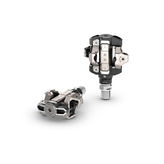 Garmin Rally RS/XC210 clipless road pedals with composite body, carbon spindle, and stainless steel cleats, in black.
