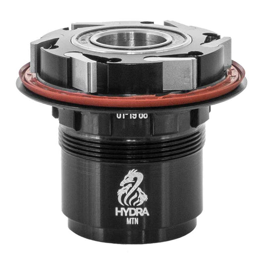 Industry Nine Hydra Freehub body for Shimano road 10 and MTB 11-speed, showing the black freehub with mounting details.