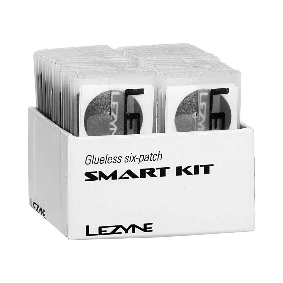 Lezyne Smart Kit patch kit with multiple patches and tools on header card for bicycle tire repairs.