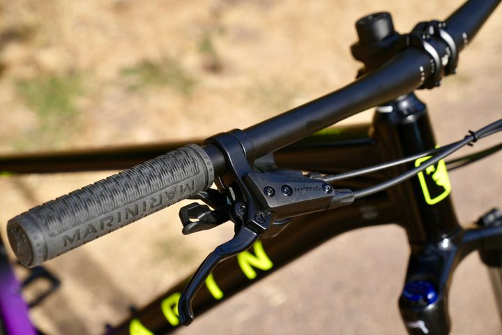 Marin Bobcat Trail 4 hardtail MTB bicycle with black frame and suspension fork, ready for trail riding.