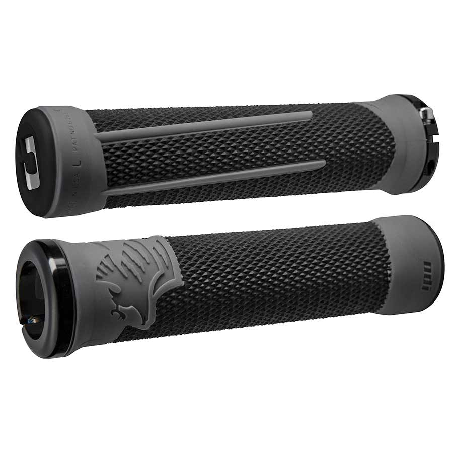 Pair of ODI AG-2 Signature black grips with graphite accents for bikes, showcasing textured rubber surface and ergonomic design.
