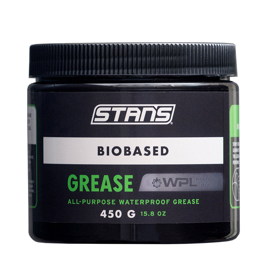 Stans No Tubes BioBased Grease 100g, a natural lubricant for bike components, shown in a clear container with branding.