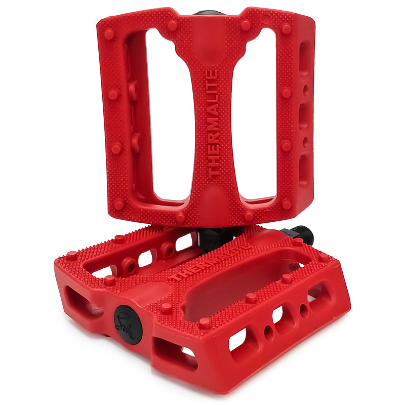 STLNbikes Thermalite Platform Pedals with colorful tie-dye design, durable metal body, and textured grip for cycling comfort.
