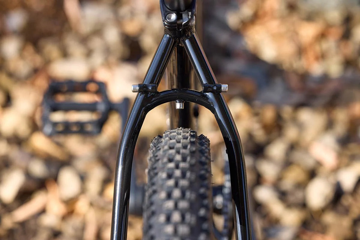 Surly Bridge Club 27.5-inch gravel bike in black, showing the frame and components on a neutral background.