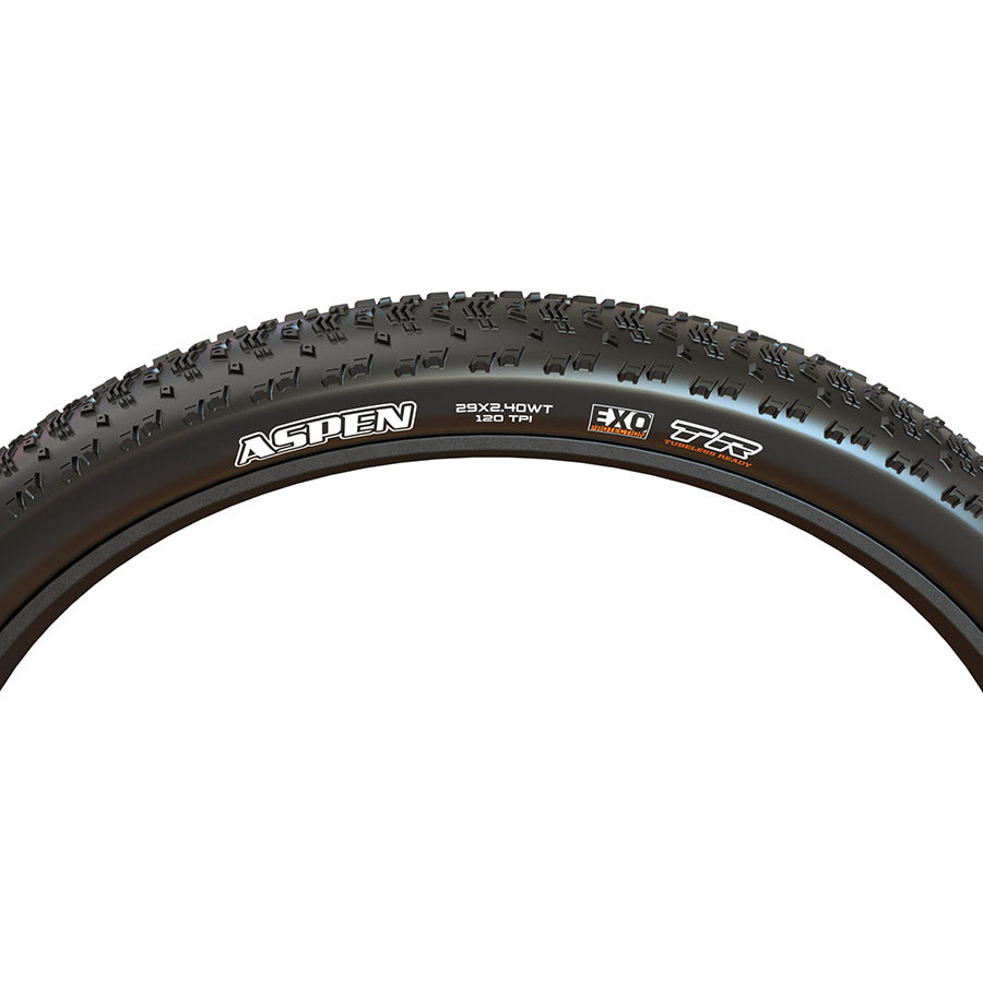 Maxxis Aspen mountain tires mounted on a wheel, showing rugged tread pattern for off-road cycling and mountain biking.