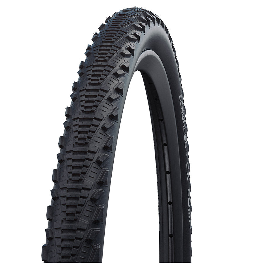 Schwalbe CX Comp gravel tire with knobby tread for off-road cycling, shown in black sidewall with tread pattern.
