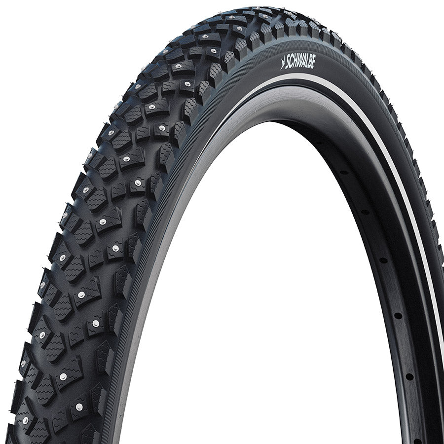 Schwalbe Marathon Winter Plus winter tires with tread pattern and sidewall design for cold weather cycling, close-up view.