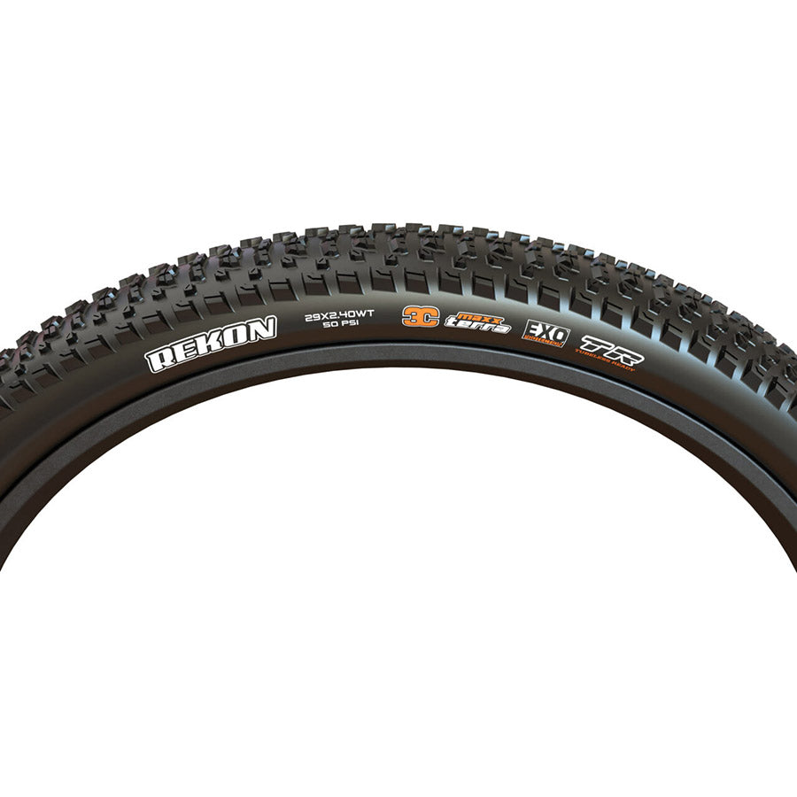 Maxxis Rekon or Rekon+ mountain tires mounted on a bike wheel, featuring rugged tread for trail riding and mountain biking.