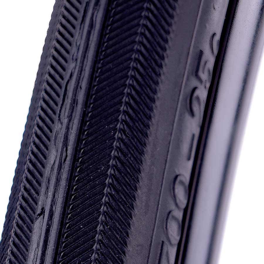 Evo Dekko road tire with black rubber tread and sidewalls, designed for performance and durability on paved surfaces.