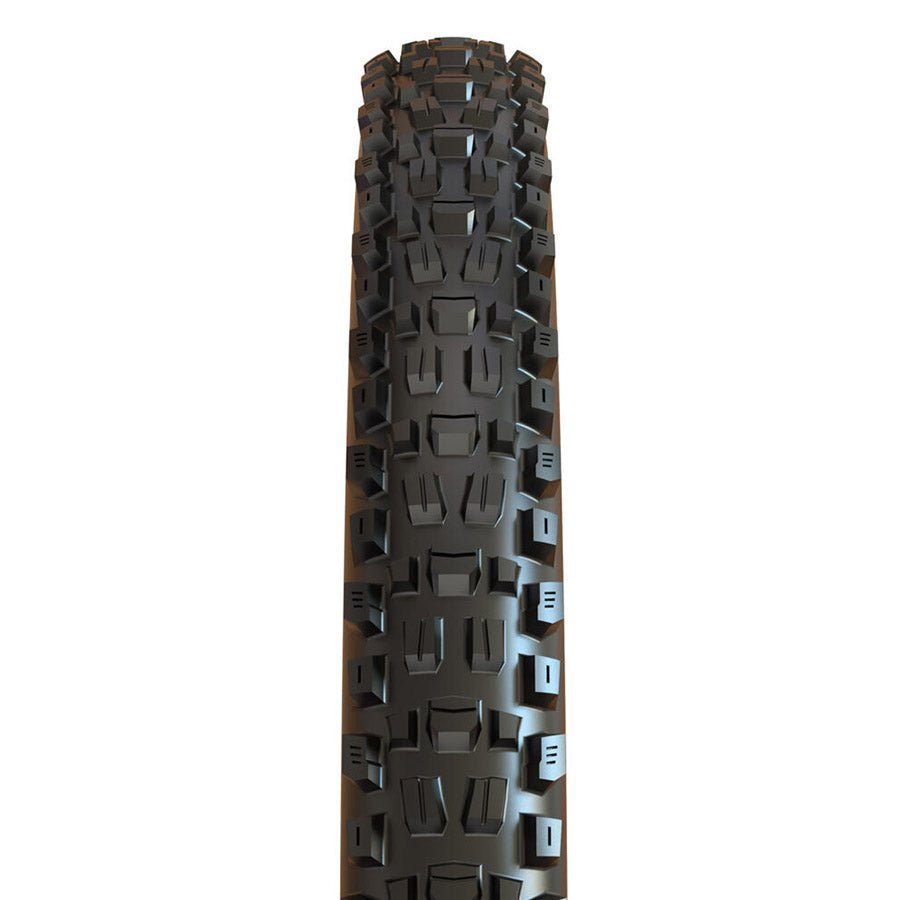 Maxxis Assegai mountain bike tires with knobby tread for rugged trail riding, shown on a black mountain bike wheel.