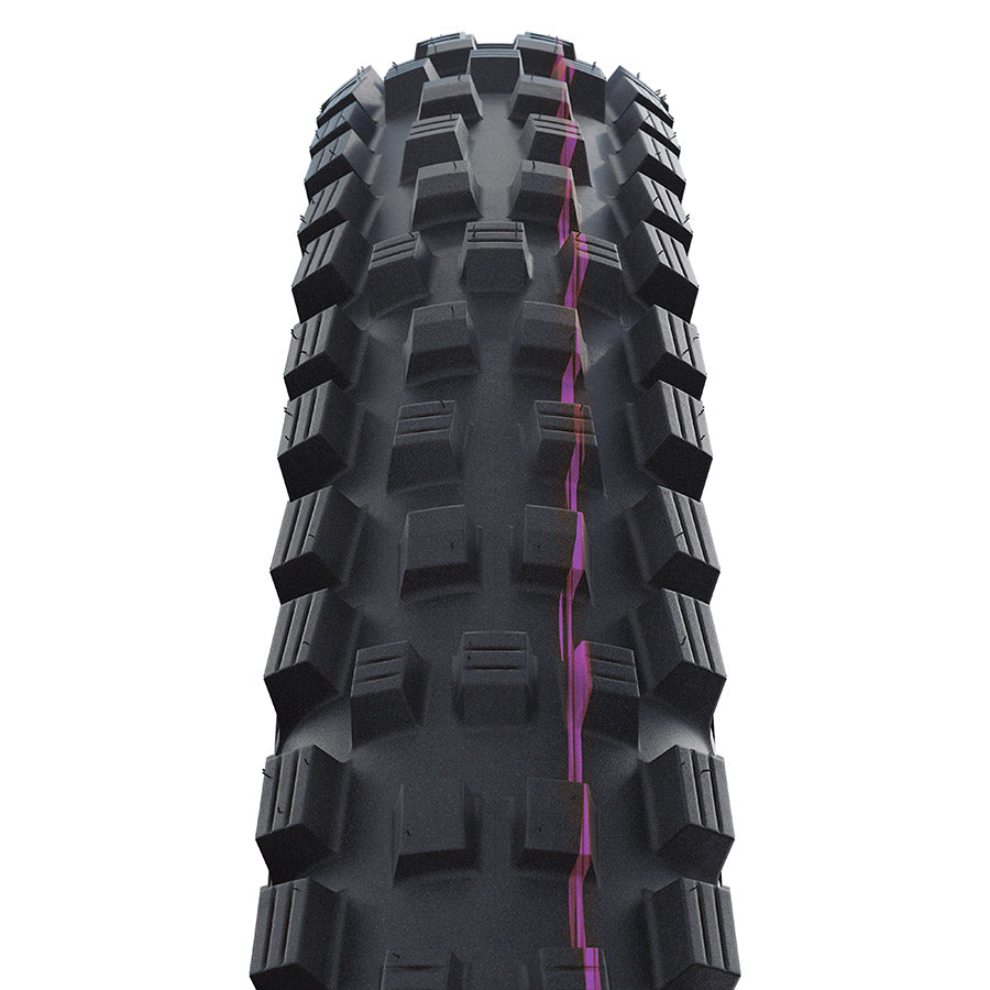 Schwalbe Magic Mary Trail Pro mountain tire with knobby tread for off-road cycling, black rubber with sidewall branding.
