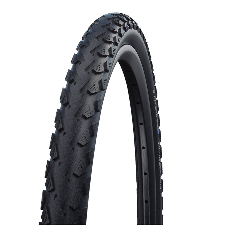 Schwalbe Land Cruiser hybrid tires mounted on a vehicle, showcasing durable rubber treads for off-road and hybrid driving conditions.