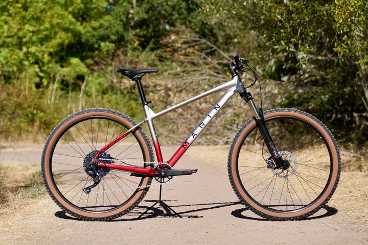 Marin Bobcat Trail 3 mountain bike with black frame and suspension fork, detailed close-up of the bike's front and drivetrain components.