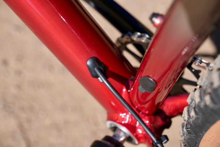 Close-up of the Marin Bobcat Trail 3 mountain bike frame with detailed suspension components and sleek black finish.