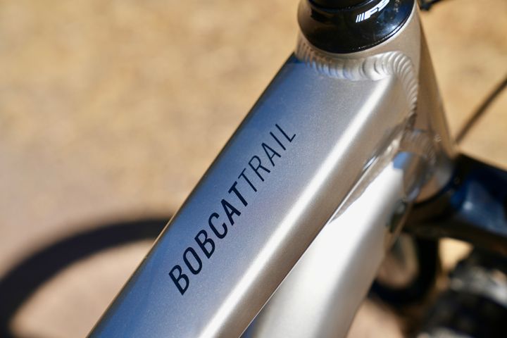 Marin Bobcat Trail 3 mountain bike with black frame and suspension forks, close-up detail of the bike's front view.
