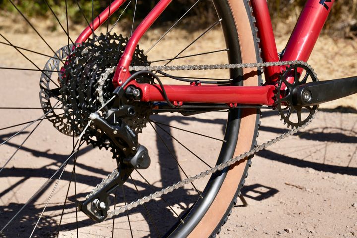 Marin Bobcat Trail 3 mountain bike with front suspension and knobby tires, shown from a detailed side view.