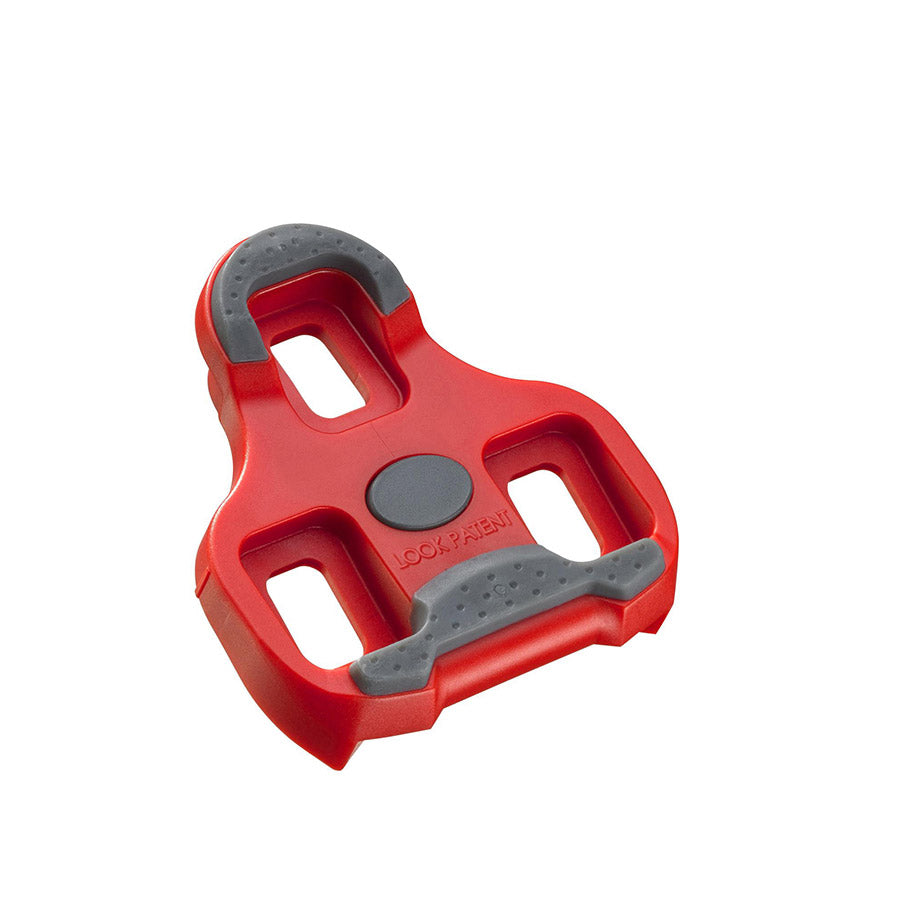 Look Keo Grip 9° red cycling cleats with textured surface and mounting hardware for road bike pedal compatibility.