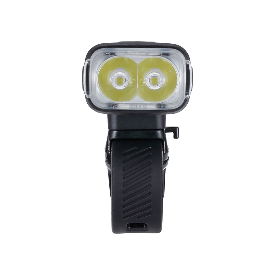 BBB Cycling BLS-263i Nanostrike 1000i bike light mounted on a bicycle handlebar, showing bright LED beam and compact design.