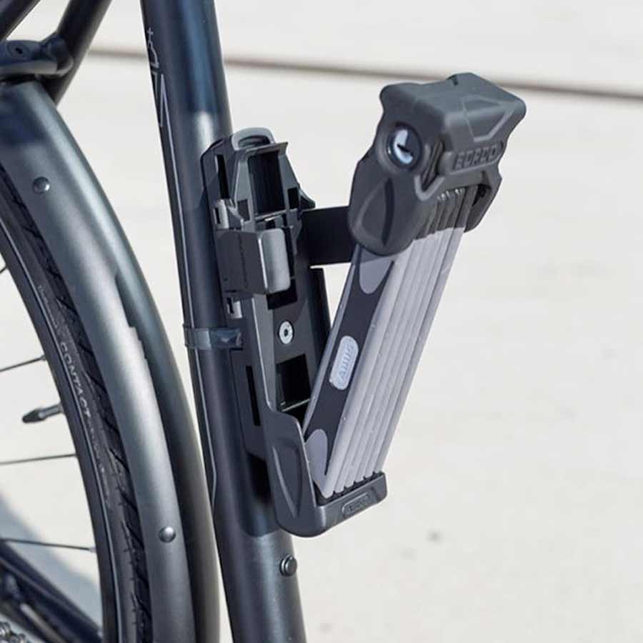 Abus Bordo Combo 6100 folding lock with flexible steel bars and combination mechanism, shown in a closed position.