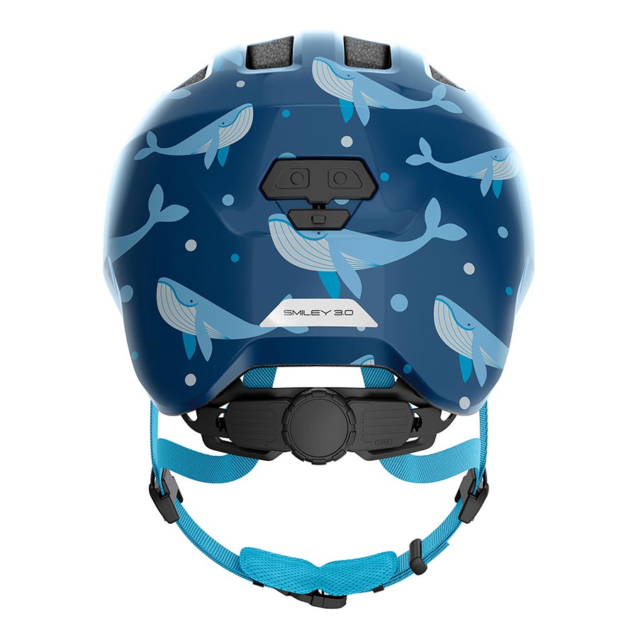 Pink Abus Smiley 3.0 youth helmet with butterfly design, featuring adjustable straps and ventilation for safe, comfortable wear.