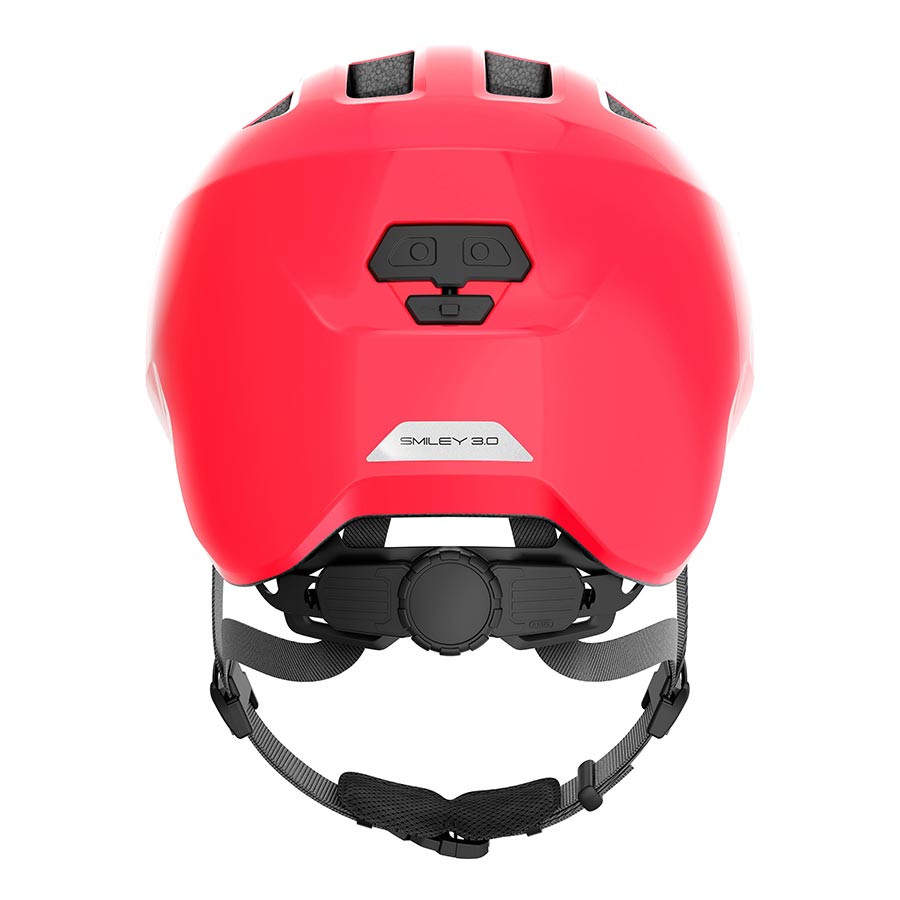 Pink Abus Smiley 3.0 youth helmet with butterfly design, featuring adjustable straps and ventilation for safe riding.