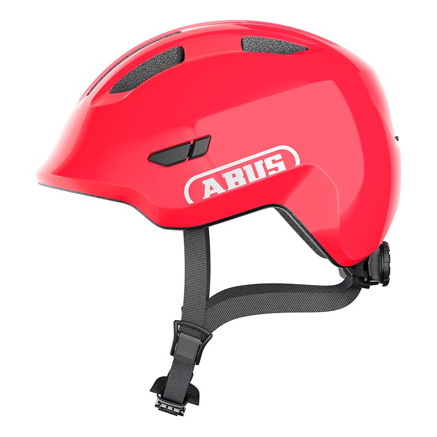 Pink Abus Smiley 3.0 youth helmet with butterfly design, featuring adjustable straps and ventilation for kids' safety.