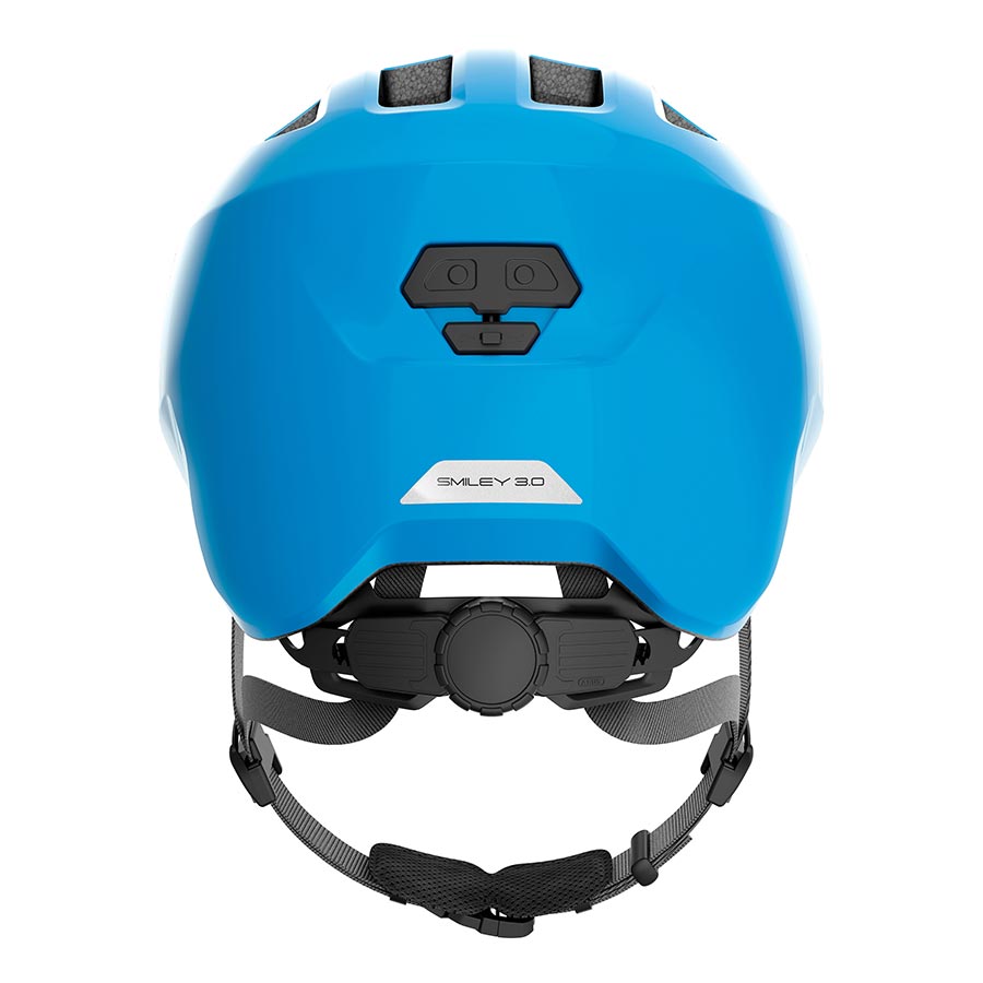 Pink Abus Smiley 3.0 youth helmet with butterfly design, adjustable straps, and ventilation for kids' safety and comfort.