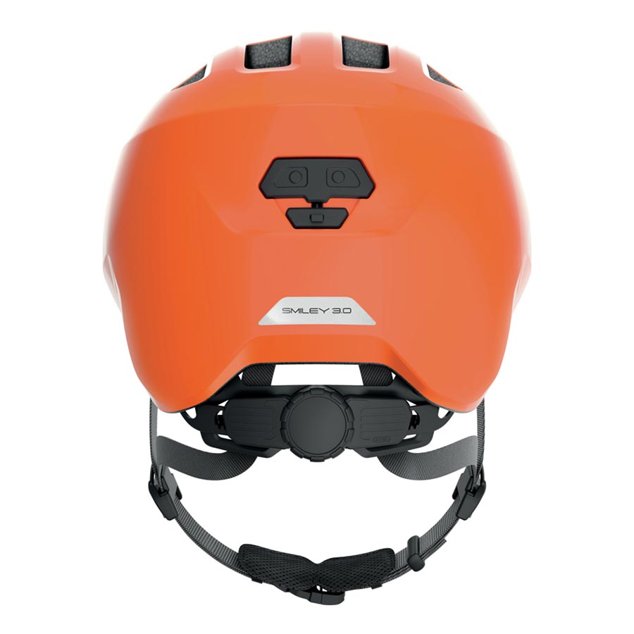 Pink Abus Smiley 3.0 youth helmet with butterfly design, featuring adjustable straps and ventilation for kids' safety.