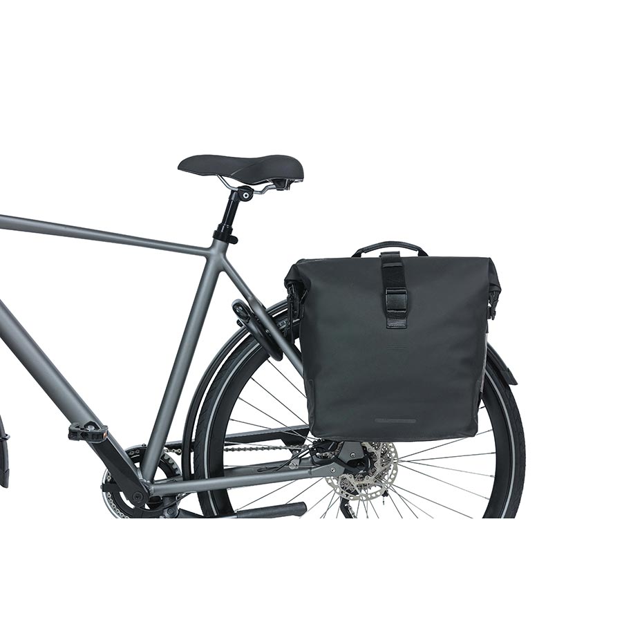 Black Basil SoHo panniers mounted on a bicycle with a 42L capacity, designed for versatile bike touring and commuting.