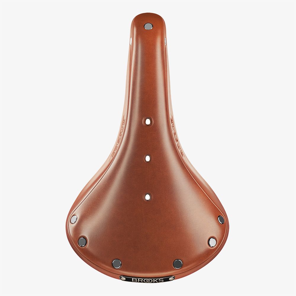Brooks B17 saddle in honey brown with leather finish, designed for comfortable bicycle riding.