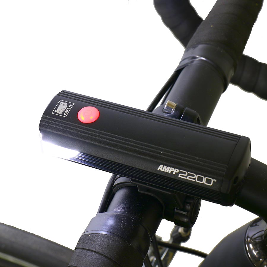 CatEye AMPP2200 bike light showing front view with adjustable strap and bright LED beam for visibility and safety.