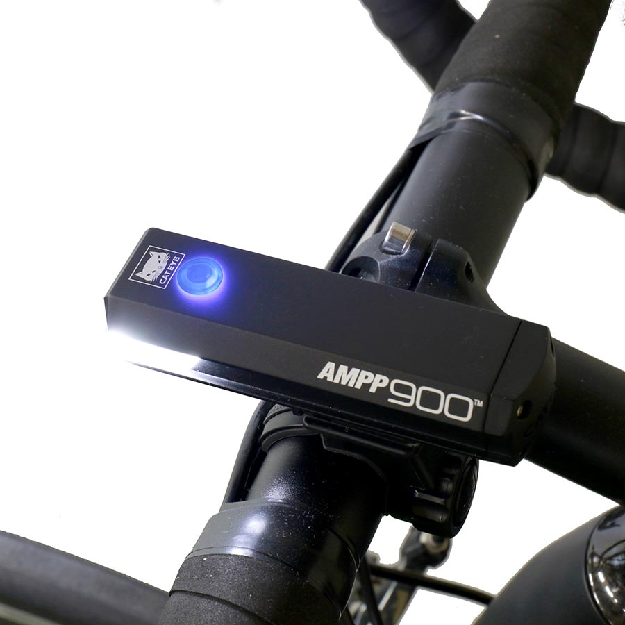CatEye AMPP900 bike light showing its front LED design and mounting bracket, designed for high visibility cycling safety.