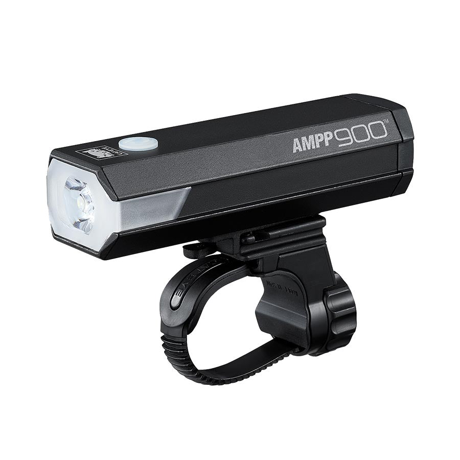 CatEye AMPP900 bike light with bright LED beam, mounted on a bicycle handlebar for enhanced visibility and safety during night rides.