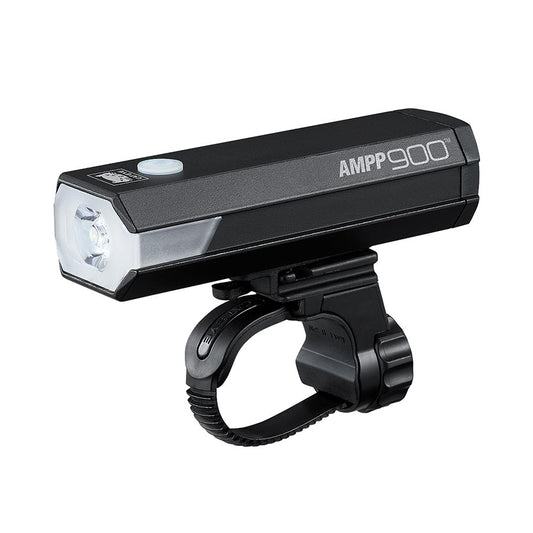 CatEye AMPP900 bike light with bright LED beam, mounted on a bicycle handlebar for enhanced visibility and safety during night rides.