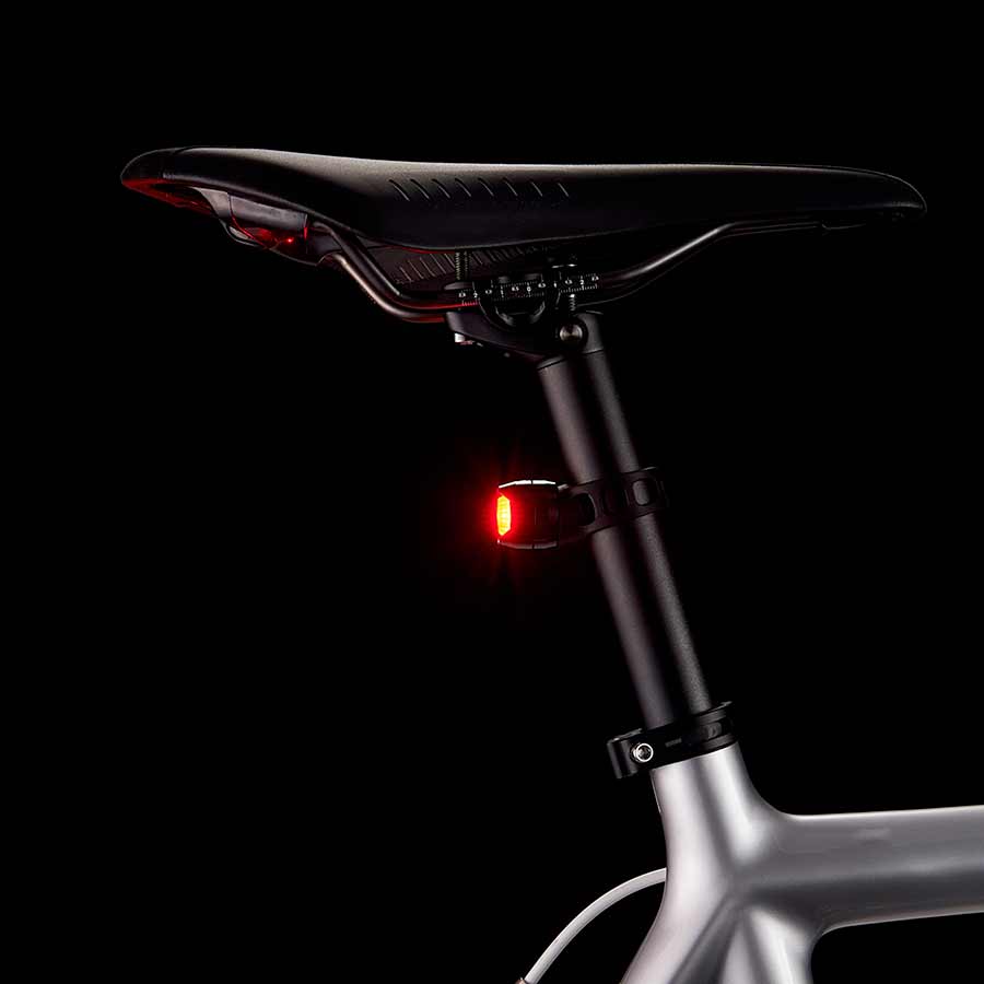 Black CatEye Orb Rechargeable rear light with LED illumination and adjustable strap for bicycles.