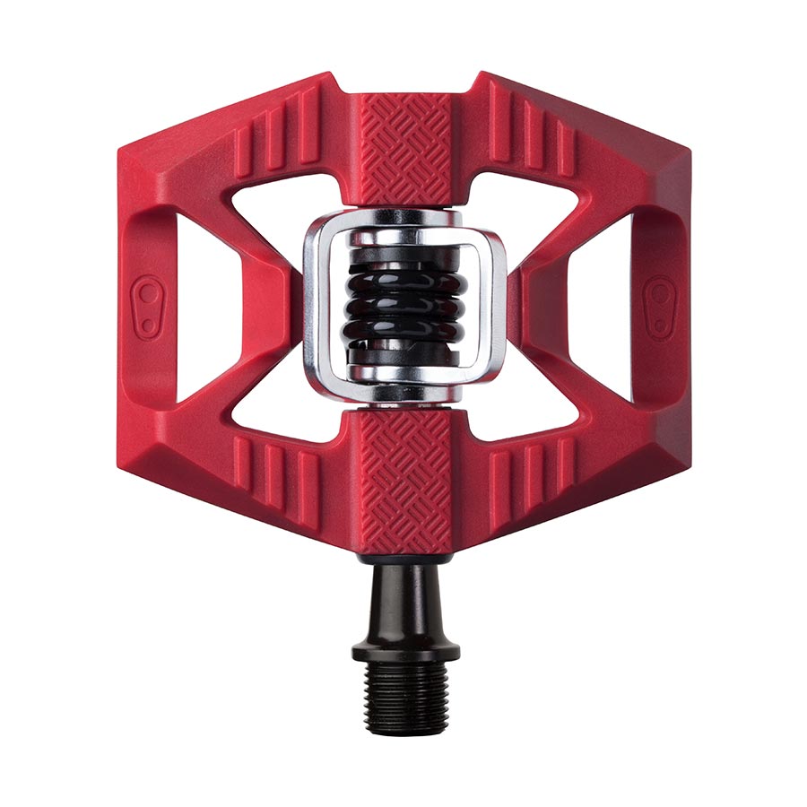 Crankbrothers DoubleShot 1 clipless MTB pedals in black, shown as a pair with pedal cleats and adjustable release mechanisms.