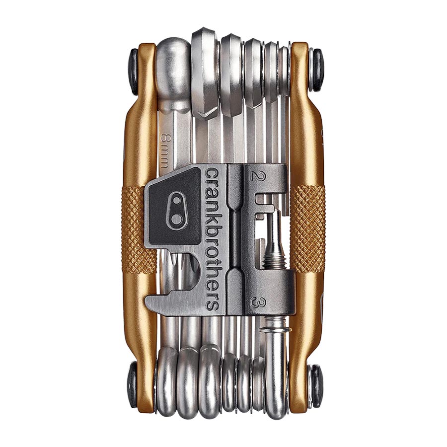 Crankbrothers Multi 19 multi-tool in black and red with various bike repair tools laid out on a white background.