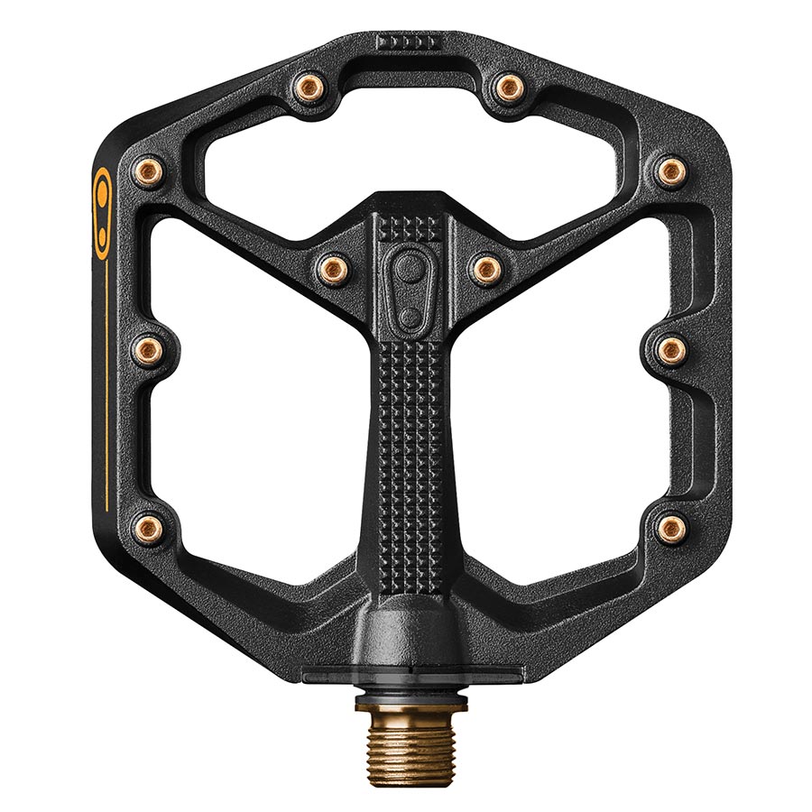 Crankbrothers Stamp 11 platform pedals with large aluminum body and titanium spindle in black and gold for mountain biking.