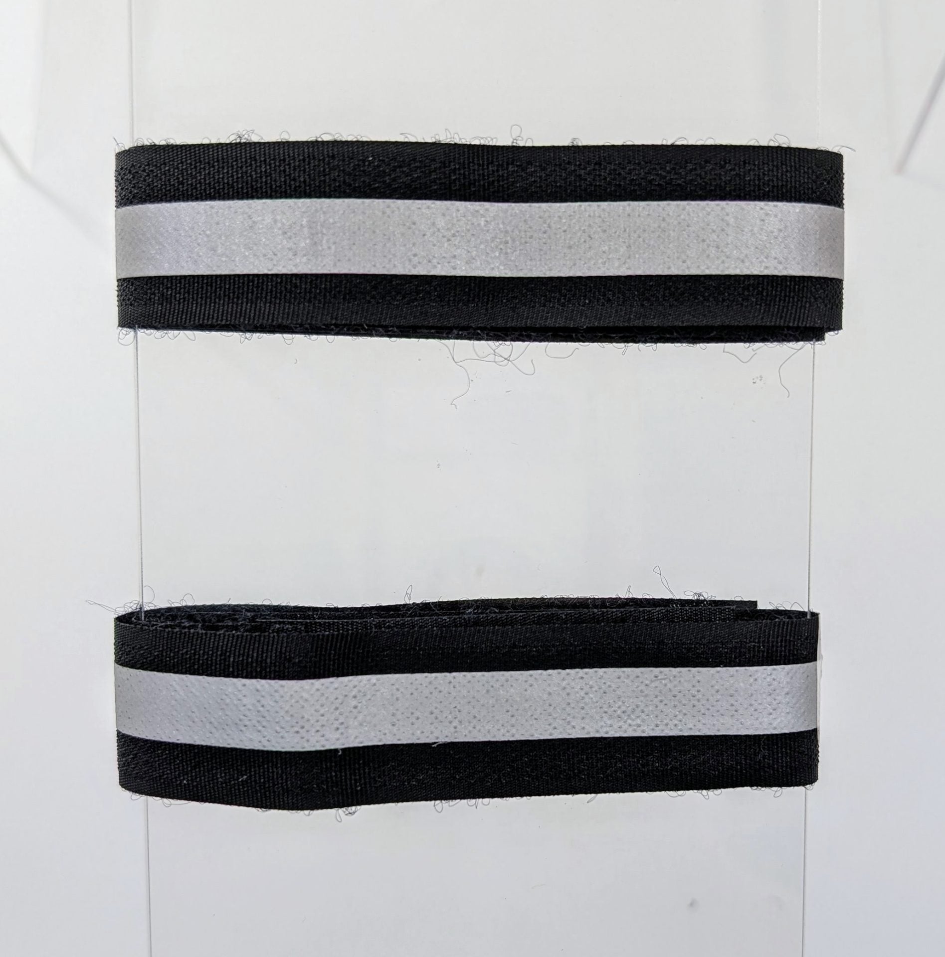 Ebon Accessories Ebon Pant-Tie safety item with adjustable strap and durable fabric for secure waist wear.