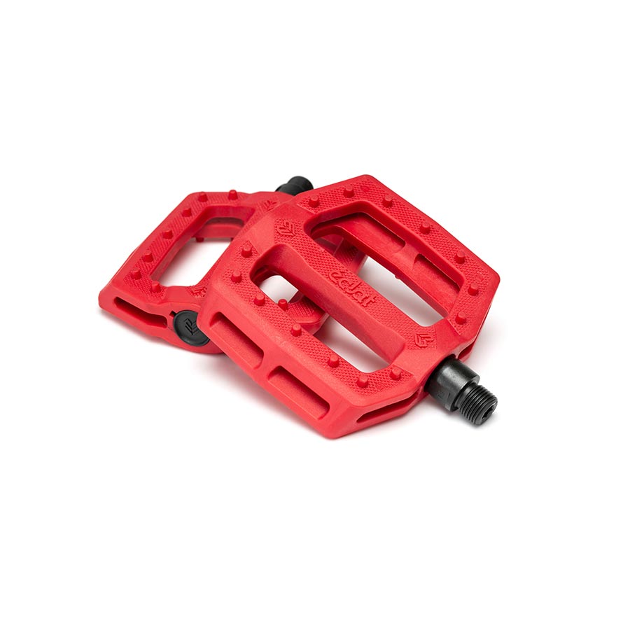 Pair of black Eclat Slash platform pedals with wide flat design and metal pins for BMX or mountain biking.