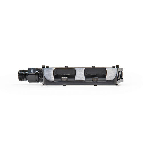 Pair of black Eclat Surge CNC platform pedals for BMX bikes, featuring durable metal construction and textured grip surfaces.