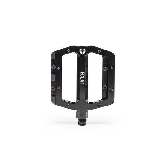 Pair of black Eclat Surge CNC platform pedals for BMX bikes, featuring durable metal construction and textured pedal surfaces.