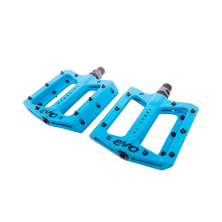 Pair of Evo Tenacity black platform pedals with metal pins for mountain biking, featuring durable construction and wide grip.