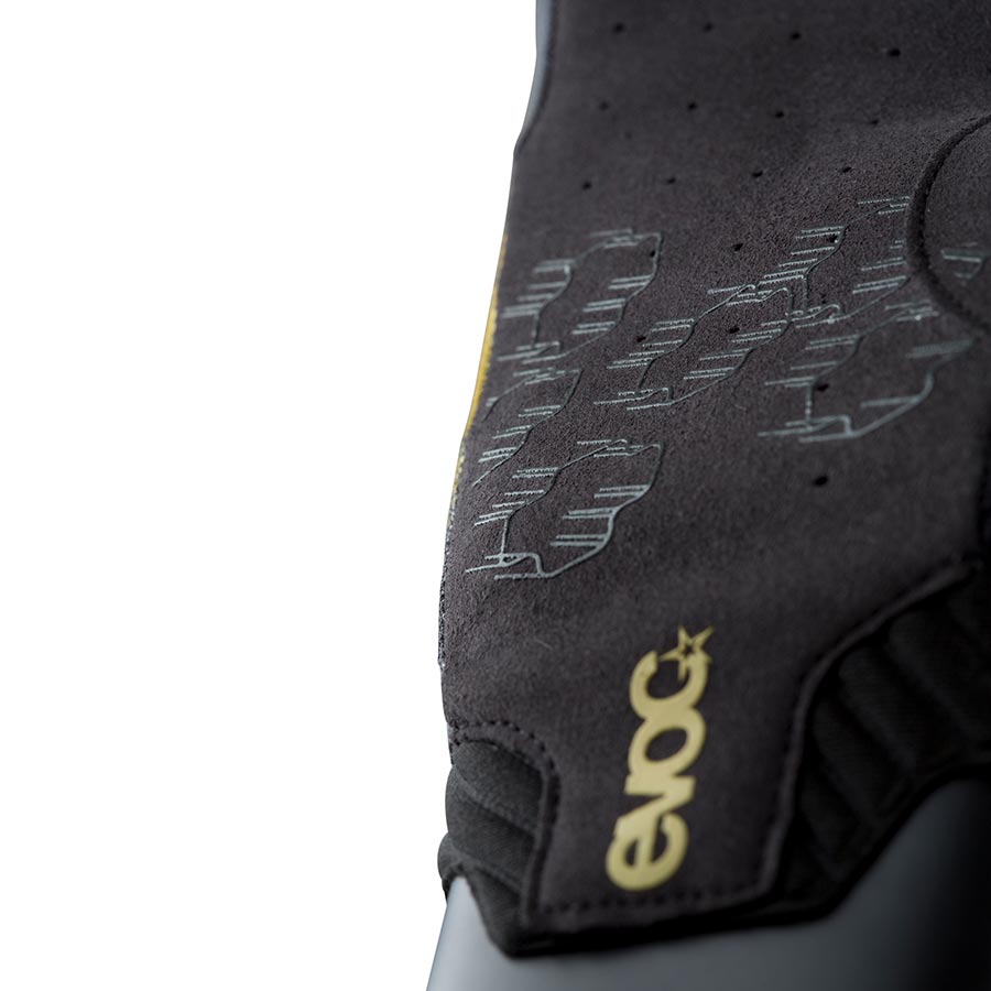 Black EVOC Enduro Touch full finger gloves shown on a rider's hands, designed for durability and grip during mountain biking.